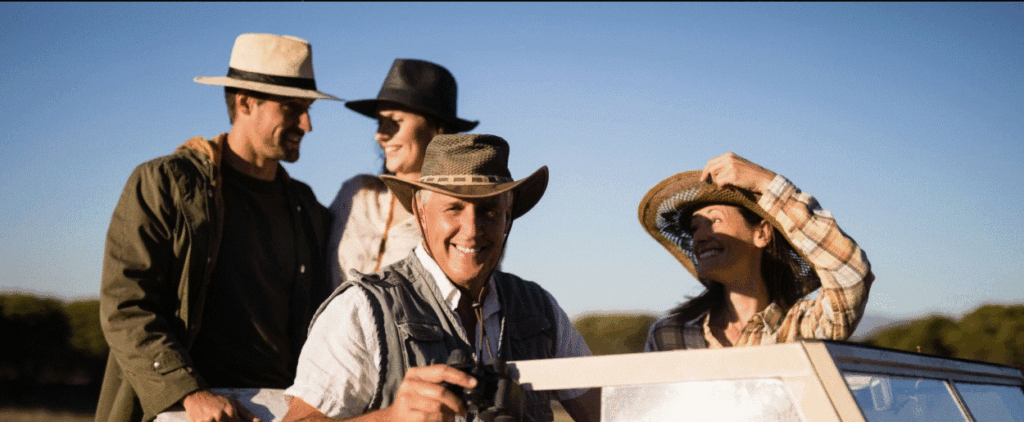 Safari guests practicing proper tipping etiquette to appreciate guides, trackers, and camp staff.
